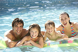 Family in Swimming Pool